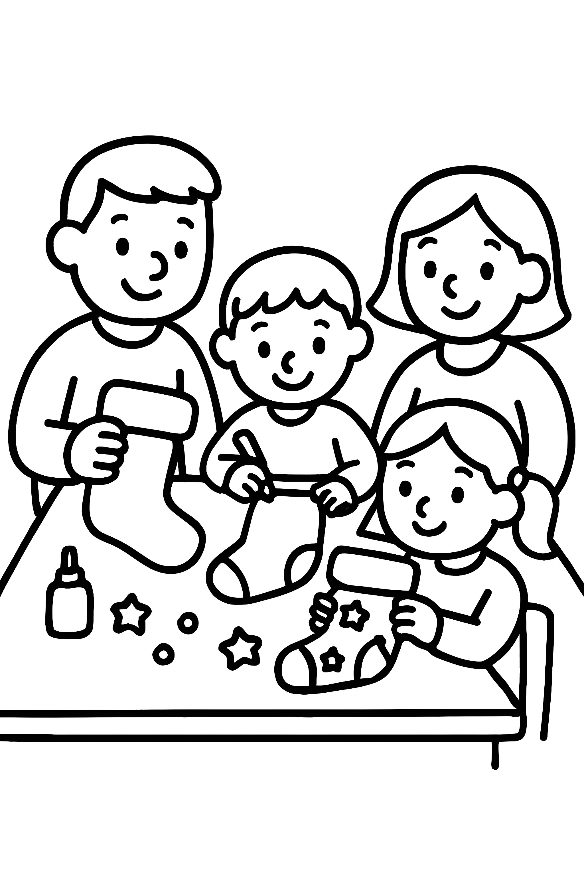 A family around a dining table, decorating Christmas stockings with glue and decorations.
